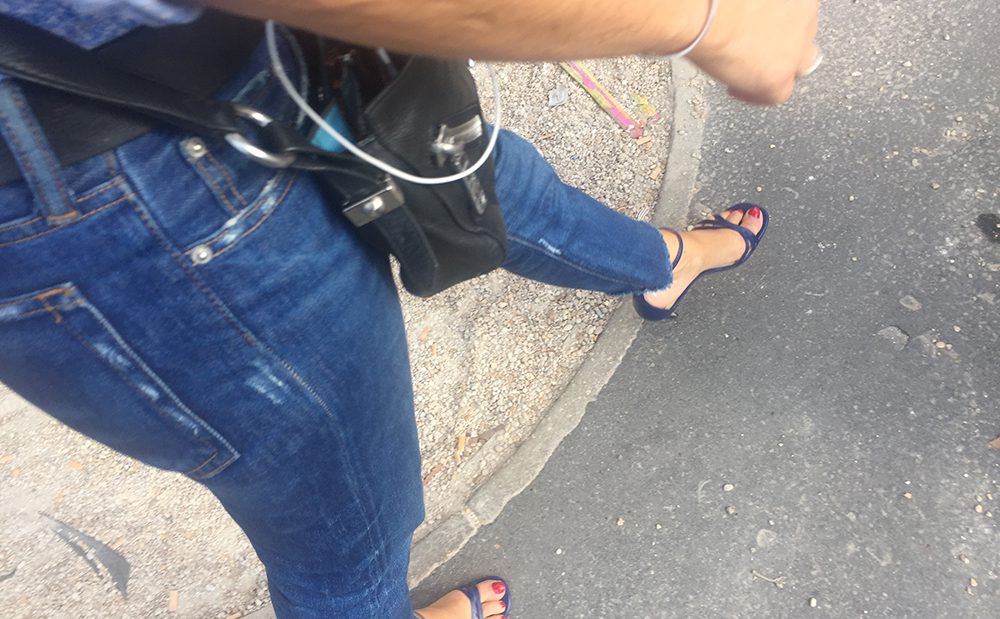 A mature woman with whore's sandals